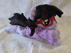 Size: 4096x3072 | Tagged: safe, artist:bluedragonflyplush, imported from derpibooru, pony, unicorn, beanie (plushie), brendon urie, clothes, commission, glasses, hoodie, horn, irl, lying down, male, panic! at the disco, photo, plushie, ponified, prone, shirt, solo, stallion, t-shirt