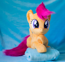 Size: 1441x1375 | Tagged: safe, artist:buttercupbabyppg, imported from derpibooru, scootaloo, pegasus, pony, female, filly, foal, happy, irl, lying down, photo, plushie, prone, smiling, solo, spread wings, wings