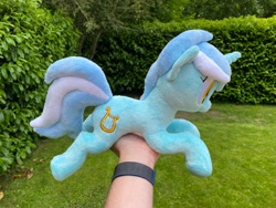 Size: 2048x1536 | Tagged: safe, artist:rtryart, imported from derpibooru, lyra heartstrings, pony, unicorn, female, happy, horn, irl, lying down, mare, outdoors, photo, plushie, prone, smiling, solo