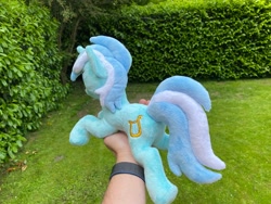 Size: 2048x1536 | Tagged: safe, artist:rtryart, imported from derpibooru, lyra heartstrings, pony, unicorn, female, happy, horn, irl, lying down, mare, outdoors, photo, plushie, prone, smiling, solo