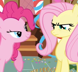 Size: 914x845 | Tagged: safe, imported from derpibooru, screencap, fluttershy, pinkie pie, earth pony, pegasus, pony, griffon the brush off, season 1, angry, cropped, duo, duo female, female, fluttershy is not amused, frown, lidded eyes, mare, out of context, smiling, unamused