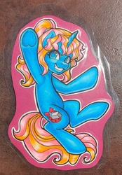 Size: 2108x3032 | Tagged: safe, artist:inkkeystudios, imported from derpibooru, pony, unicorn, badge, eye clipping through hair, grin, looking at you, photo, smiling, solo, traditional art, underhoof