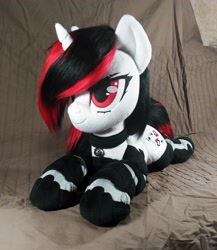 Size: 2946x3394 | Tagged: safe, artist:doctorkoda, imported from derpibooru, oc, oc only, oc:blackjack, pony, unicorn, fallout equestria, fallout equestria: project horizons, bell, bell collar, collar, female, horn, irl, lying down, photo, plushie, prone, solo