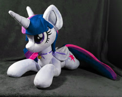 Size: 1636x1302 | Tagged: safe, artist:doctorkoda, imported from derpibooru, twilight sparkle, alicorn, pony, female, folded wings, happy, horn, irl, lying down, mare, photo, plushie, prone, smiling, solo, twilight sparkle (alicorn), wings