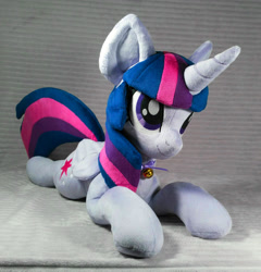Size: 1336x1394 | Tagged: safe, artist:doctorkoda, imported from derpibooru, twilight sparkle, alicorn, pony, female, folded wings, happy, horn, irl, lying down, mare, photo, plushie, prone, smiling, solo, twilight sparkle (alicorn), wings