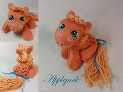 Size: 1280x961 | Tagged: safe, artist:starfulstitches, imported from derpibooru, applejack (g1), earth pony, pony, female, g1, lying down, mare, photo, plushie, prone, solo