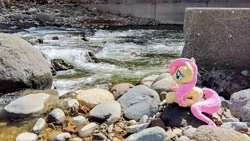Size: 2048x1152 | Tagged: safe, imported from derpibooru, photographer:pakapaka1993, fluttershy, pony, cute, irl, japan, photo, plushie, river, sitting, solo, water