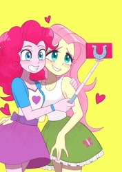 Size: 848x1199 | Tagged: safe, artist:haibaratomoe, imported from derpibooru, fluttershy, pinkie pie, equestria girls, belt, blushing, cellphone, clothes, cute, diapinkes, duo, female, flutterpie, grin, heart, lesbian, phone, selfie, selfie stick, shipping, shyabetes, simple background, skirt, smartphone, smiling, tanktop, yellow background