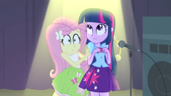 Size: 3072x1727 | Tagged: safe, imported from derpibooru, screencap, fluttershy, twilight sparkle, human, equestria girls, rainbow rocks, bare shoulders, clothes, cute, cutie mark on clothes, duo, duo female, female, frown, hairpin, microphone, microphone stand, musical instrument, shyabetes, sleeveless, spotlight, tambourine