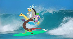Size: 1172x625 | Tagged: safe, editor:incredibubbleirishguy, imported from derpibooru, clear sky, discord, spike, draconequus, dragon, blue, duo, duo male, male, ocean, real life background, summer, surfboard, surfing, water, wave, winged spike, wings
