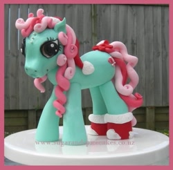 Size: 570x560 | Tagged: safe, imported from derpibooru, minty, earth pony, pony, bow, cake, christmas, clothes, curly hair, etsy, fondant, food, g3, hat, holiday, irl, new zealand, pearl, photo, santa hat, socks, solo, tail, tail bow, watermark, website