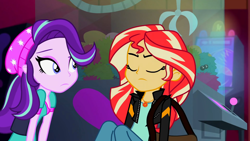 Size: 3072x1727 | Tagged: safe, imported from derpibooru, screencap, starlight glimmer, sunset shimmer, human, equestria girls, mirror magic, spoiler:eqg specials, beanie, canterlot mall, cinema, clothes, duo, duo female, eyes closed, female, frown, geode of empathy, hat, jacket, jewelry, leather, leather jacket, magical geodes, necklace