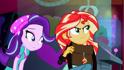 Size: 3072x1727 | Tagged: safe, imported from derpibooru, screencap, starlight glimmer, sunset shimmer, human, equestria girls, mirror magic, spoiler:eqg specials, beanie, canterlot mall, cinema, clothes, duo, duo female, female, frown, hat, jacket, leather, leather jacket