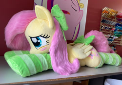 Size: 2363x1658 | Tagged: safe, artist:qtpony, imported from derpibooru, fluttershy, pony, clothes, irl, lying down, photo, plushie, prone, socks, solo