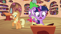 Size: 1920x1080 | Tagged: safe, imported from derpibooru, screencap, apple bloom, applejack, spike, twilight sparkle, dragon, earth pony, pony, unicorn, season 2, the cutie pox, applejack's hat, book, cowboy hat, cutie pox, female, filly, foal, golden oaks library, hat, male, mare, unicorn twilight