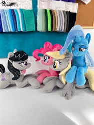 Size: 3024x4032 | Tagged: safe, artist:kazzysart, imported from derpibooru, derpy hooves, octavia melody, pinkie pie, trixie, earth pony, pegasus, pony, unicorn, irl, lying down, photo, plushie, prone, sploot