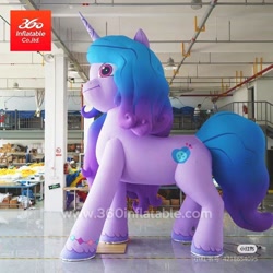 Size: 800x800 | Tagged: safe, imported from derpibooru, izzy moonbow, human, inflatable pony, pony, unicorn, 360 inflatable, female, g5, horn, indoors, inflatable, inflatable unicorn, irl, irl human, izzy is tol, logo, mare, matte, photo, shiny floor, side view, solo, standing, watermark