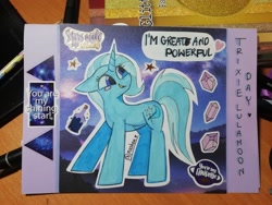 Size: 4160x3120 | Tagged: safe, artist:mashee, imported from derpibooru, trixie, unicorn, adorable face, blushing, crystal, cute, great and powerful, happy, horn, looking up, night, photo, purple background, simple background, standing, stars, sticker, traditional art, trixie day