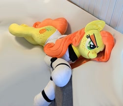 Size: 1733x1490 | Tagged: safe, artist:madi, imported from derpibooru, oc, oc only, oc:anna pine, earth pony, pony, clothes, freckles, green eyes, lying down, orange mane, orange tail, photo, plushie, smug, suit, tail, yellow mane