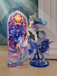 Size: 2126x2834 | Tagged: safe, imported from derpibooru, kotobukiya, princess celestia, princess luna, alicorn, acrylic plastic, acrylic standee, craft, duo, kotobukiya princess celestia, kotobukiya princess luna, looking at each other, looking at someone, looking at you, merchandise, official, spread wings, stained glass, stars, sun, wings