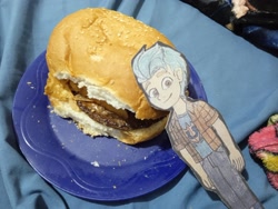 Size: 2080x1560 | Tagged: safe, artist:garybaldor, imported from derpibooru, hitch trailblazer, human, burger, clothes, food, g5, hamburger, humanized, irl, pants, paper doll, photo, plate, shirt, solo, traditional art