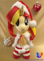 Size: 2128x2904 | Tagged: safe, artist:1stastrastudio, imported from derpibooru, sunset shimmer, pony, christmas, clothes, hat, holiday, irl, photo, plushie, santa hat, socks, solo, striped socks