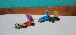 Size: 4160x1920 | Tagged: safe, artist:tom artista, imported from derpibooru, fluttershy, rainbow dash, twilight sparkle, alicorn, pegasus, pony, ball, car, crossover, duo, duo female, female, hot wheels, indoors, kinder egg, quad bike, rocket league, tank (vehicle), toy, twilight sparkle (alicorn)