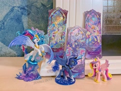 Size: 4380x3285 | Tagged: safe, imported from derpibooru, kotobukiya, princess cadance, princess celestia, princess luna, pony, belly, concave belly, figure, funko, irl, kayou, large wings, merchandise, music notes, official, photo, rainbow power, rainbow power-ified, raised hoof, search fun, side view, slender, spread wings, statue, thin, ticket, toy, wings