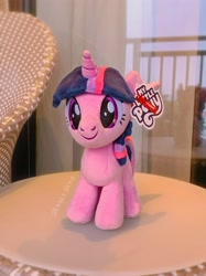 Size: 2030x2707 | Tagged: safe, imported from derpibooru, twilight sparkle, alicorn, pony, chair, fixed, front view, irl, merchandise, miniso, official, photo, plushie, pony plushie, reesee, reflection, smiling, solo, twilight sparkle (alicorn)