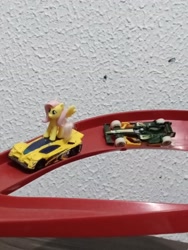 Size: 2448x3264 | Tagged: safe, artist:tom artista, imported from derpibooru, fluttershy, pegasus, pony, car, crossover, female, formula 1, hot wheels, indoors, kinder egg, pilot, race, race track, racecar, racing, side draft, toy, tracks, vehicle