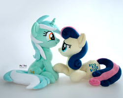 Size: 1600x1279 | Tagged: safe, artist:meplushyou, imported from derpibooru, bon bon, lyra heartstrings, sweetie drops, earth pony, pony, unicorn, duo, female, irl, lesbian, looking at each other, looking at someone, lyrabon, photo, plushie, shipping, sitting, smiling