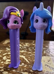 Size: 2123x2911 | Tagged: safe, imported from derpibooru, izzy moonbow, pipp petals, pegasus, unicorn, duo, duo female, female, g5, irl, pez, pez dispenser, photo, photography