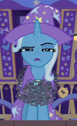 Size: 225x365 | Tagged: safe, imported from derpibooru, screencap, trixie, uncommon bond, cape, chains, clothes, cropped, hat, lock, solo, trixie's cape, trixie's hat