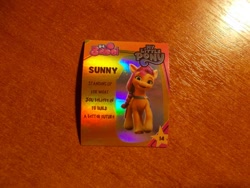 Size: 1024x768 | Tagged: safe, imported from derpibooru, sunny starscout, earth pony, description, g5, indonesian, info, irl, logo, looking at you, merchandise, my little pony: a new generation, official, photo, profile, shiny, smiling, smiling at you, standing, stars, sticker