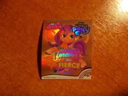 Size: 1024x768 | Tagged: safe, imported from derpibooru, sunny starscout, earth pony, 2d, g5, horseshoes, indonesian, looking away, merchandise, official, photo, shiny, slogan, smiling, sticker