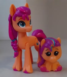 Size: 1621x1859 | Tagged: safe, imported from derpibooru, sunny starscout, earth pony, pony, comparison, g5, horn, irl, mane stripe sunny, merchandise, pencil topper, photo, self paradox, self ponidox, toy