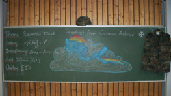 Size: 2000x1128 | Tagged: safe, artist:whatthescoots, imported from twibooru, rainbow dash, pegasus, pony, 2011, chalkboard, clothes, cloud, eyes closed, female, german, image, mare, military, needs more jpeg, on back, photo, solo, traditional art, uniform