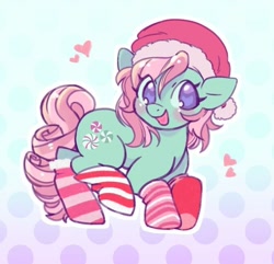 Size: 564x543 | Tagged: safe, artist:horseyuris, imported from derpibooru, minty, earth pony, pony, blushing, cheeks, christmas, clothes, curly mane, curly tail, cutie mark, g3, gradient background, green coat, happy, hat, heart, holiday, looking at you, pink mane, polka dot background, purple eyes, santa hat, smiling, smiling at you, socks, solo, striped socks, tail