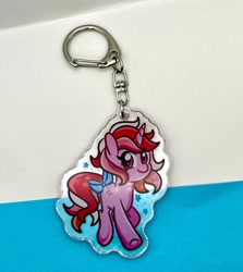 Size: 2250x2518 | Tagged: safe, artist:redpalette, imported from derpibooru, galaxy (g1), unicorn, bow, g1, horn, keychain, looking at you, merchandise, photo, smiling