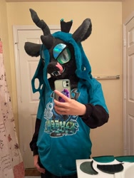 Size: 1536x2048 | Tagged: safe, artist:limeythecheetah, imported from derpibooru, queen chrysalis, changeling, changeling queen, female, fursuit, hand on hip, indoors, irl, phone, photo, selfie, tongue out