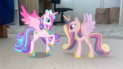 Size: 4032x2268 | Tagged: safe, imported from derpibooru, princess cadance, princess flurry heart, alicorn, pony, 3d, 3d model, adult flurry heart, augmented reality, chair, crown, duo, female, funko, gameloft, hoof shoes, irl, jewelry, looking at each other, looking at someone, mare, mother and child, mother and daughter, my little pony: magic princess, older, older flurry heart, peytral, photo, ponies in real life, raised hoof, regalia, rug, spread wings, toy, wings