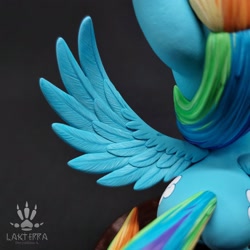 Size: 2560x2560 | Tagged: safe, alternate angle, alternate version, artist:lakterra, imported from derpibooru, rainbow dash, pegasus, pony, both cutie marks, butt, close-up, craft, female, figurine, high angle, irl, mare, photo, plot, polymer clay, signature, solo, spread wings, stand, tail, wings