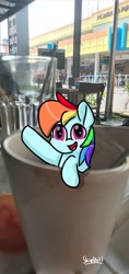 Size: 567x1200 | Tagged: safe, artist:skylinepony_, imported from derpibooru, rainbow dash, pegasus, pony, cup, cup of pony, female, hoof in air, irl, mare, micro, open mouth, open smile, photo, ponies in real life, real life background, smiling, solo, waving