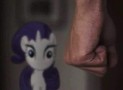 Size: 590x430 | Tagged: safe, imported from derpibooru, screencap, rarity, human, pony, unicorn, fanfic:my little dashie, abuse, abusive human, clenched fist, cropped, female, horn, irl, irl human, looking at you, male, mare, out of context, photo, ponies in real life, raribuse