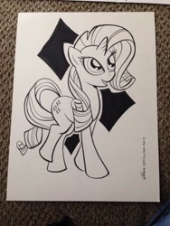 Size: 768x1024 | Tagged: safe, artist:thom zahler, imported from derpibooru, rarity, pony, unicorn, 2014, black and white, commission, female, grayscale, heroescon, heroescon 2014, horn, looking up, mare, monochrome, open mouth, open smile, photo, raised leg, signature, smiling, solo, tail, traditional art