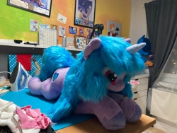 Size: 2048x1536 | Tagged: safe, artist:melodis, artist:melodisde, imported from derpibooru, izzy moonbow, pony, unicorn, accessory, bracelet, female, friendship bracelet, g5, horn, irl, jewelry, life size, lying down, mare, photo, plushie, prone, solo