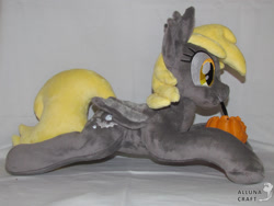 Size: 2687x2016 | Tagged: safe, artist:allunacraft, imported from derpibooru, derpy hooves, bat pony, pony, bat ponified, derpybat, irl, lying down, mouth hold, photo, plushie, prone, pumpkin bucket, race swap, solo, sploot