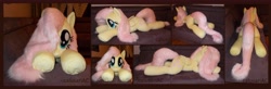 Size: 9048x2984 | Tagged: safe, artist:calusariac, imported from derpibooru, fluttershy, pegasus, pony, absurd resolution, irl, lying down, photo, plushie, prone, solo, sploot