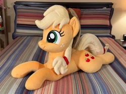 Size: 4032x3024 | Tagged: safe, artist:littlefairyswonders, imported from derpibooru, applejack, earth pony, pony, applejack's hat, bed, cowboy hat, female, hat, irl, lying down, photo, plushie, solo