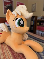 Size: 3072x4096 | Tagged: safe, artist:littlefairyswonders, imported from derpibooru, applejack, earth pony, pony, female, irl, lying down, missing accessory, photo, plushie, solo